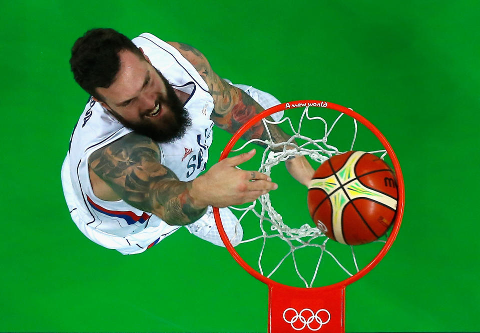 Serbia's Miroslav Raduljica dunks home two of his team-high 25 points. (Pool/Getty Images)