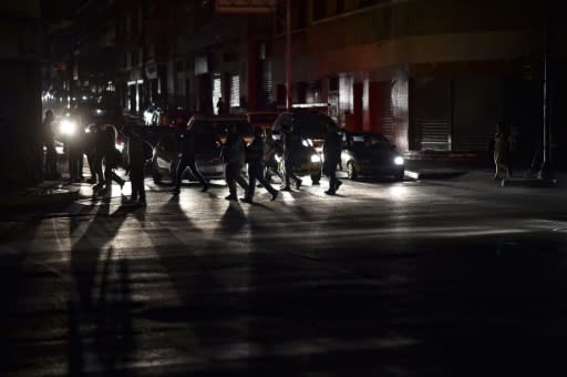 The streets of Caracas go dark in a blackout the government blames on sabotage of hydroelectric power plant