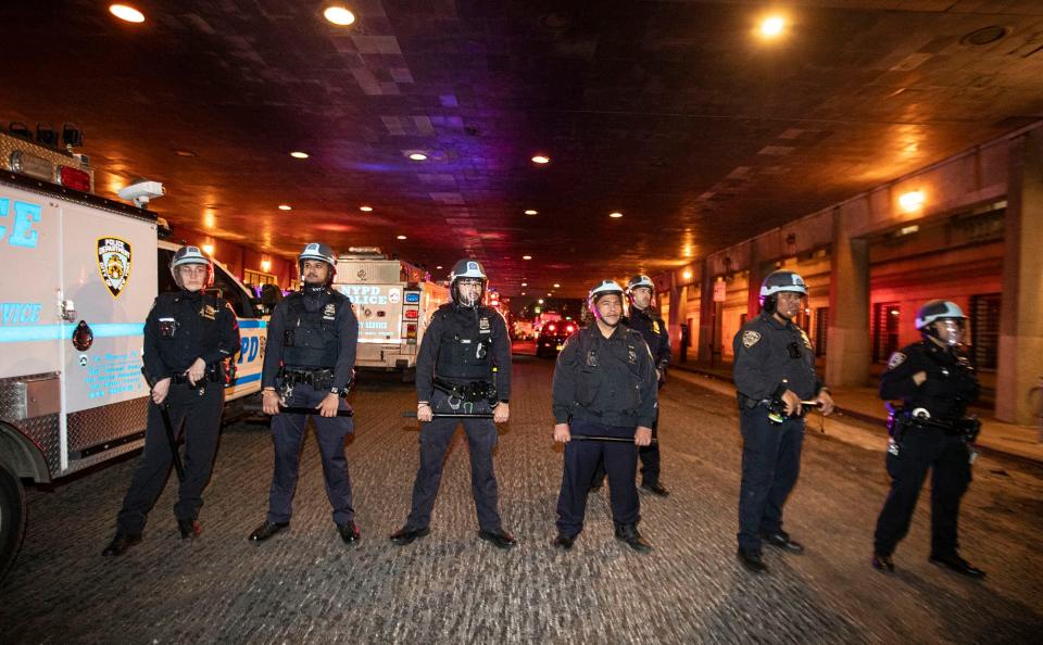 Hundreds of police officers stand near Columbia University April 30, 2024 as they get ready to rid the campus of protesters.