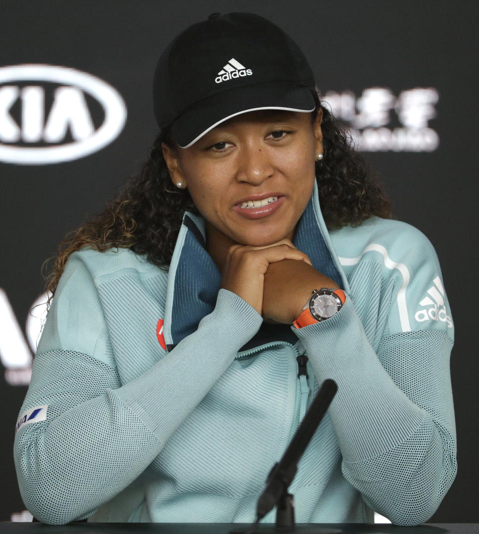 Japan's Naomi Osaka answers questions at a press conference following her win over Karolina Pliskova of the Czech Republic in their semifinal at the Australian Open tennis championships in Melbourne, Australia, Thursday, Jan. 24, 2019. (AP Photo/Mark Schiefelbein)