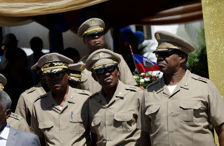 Members of the Joint Chiefs of Staff of the Haitian Armed Forces (FAD'H) wait for the arrival of Haitian President Jovenel Moise during a ceremony in Port-au-Prince, Haiti, March 27, 2018. REUTERS/Andres Martinez Casares