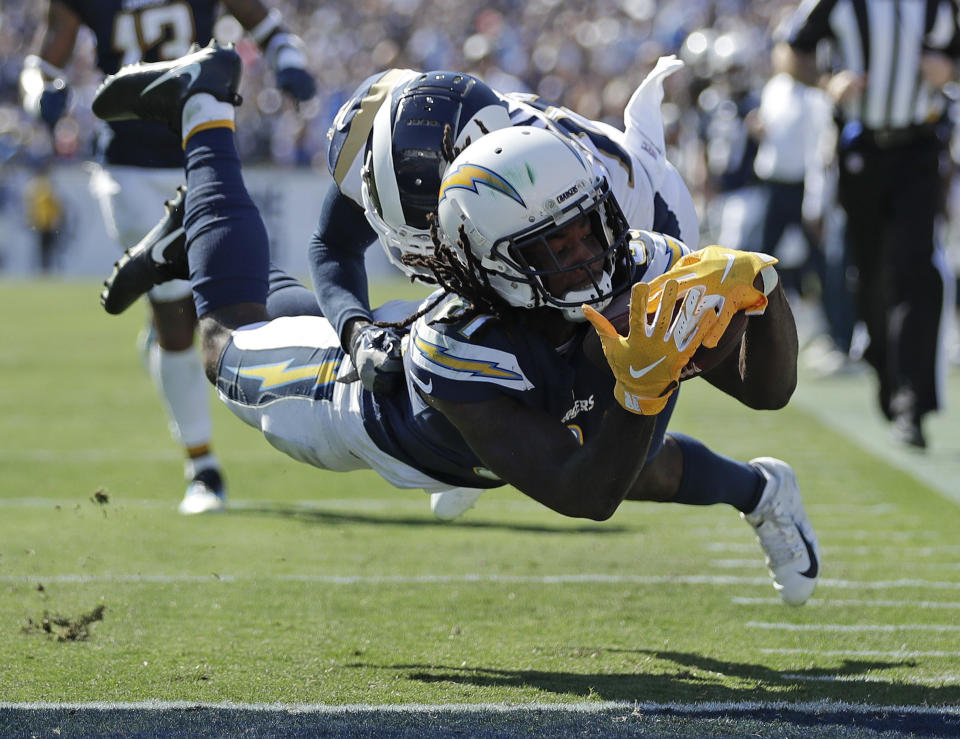 Los Angeles Chargers wide receiver Mike Williams scores in front of Los Angeles Rams defensive back Lamarcus Joyner during the second half in an NFL football game Sunday, Sept. 23, 2018, in Los Angeles. (AP Photo/Jae C. Hong)