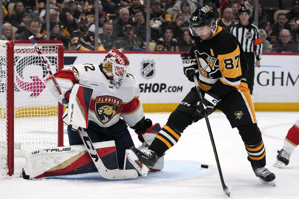 Pittsburgh Penguins' Sidney Crosby (87) can't get his stick on a pass in front of Florida Panthers goaltender Sergei Bobrovsky during the second period of an NHL hockey game in Pittsburgh, Friday, Jan. 26, 2024. (AP Photo/Gene J. Puskar)