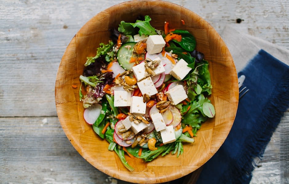 Spinach, Tofu, and Shaved Carrot Salad with Sesame Dressing and Spiced Pepita and Cashew Crunch