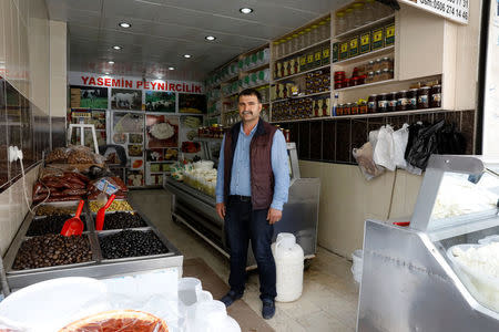 Food vendor Adil Aydin, 47, who says he will vote 'Yes', poses in his shop in Diyarbakir, Turkey, April 6, 2017. REUTERS/Umit Bektas