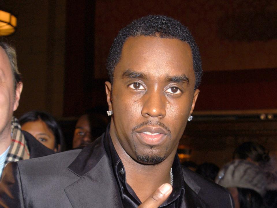 Sean Combs in a black suit and shirt