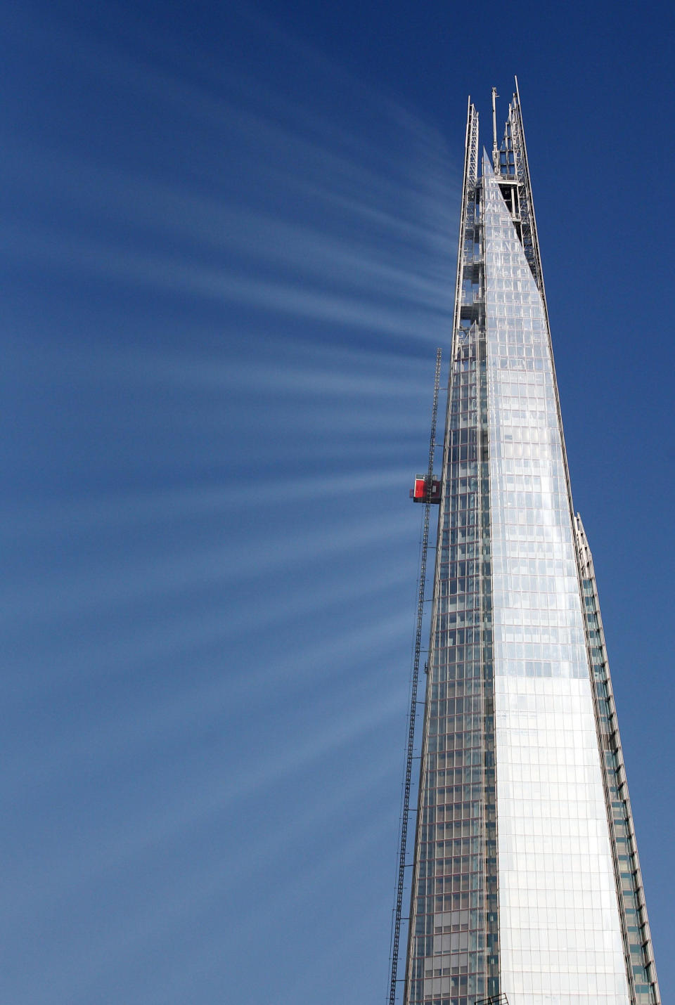 This spectacular image shows beams of light reflecting off the nearly completed glass-clad Shard in Central London. The 1,061ft building - Europe’s tallest - looked stunning in the glorious sunshine.