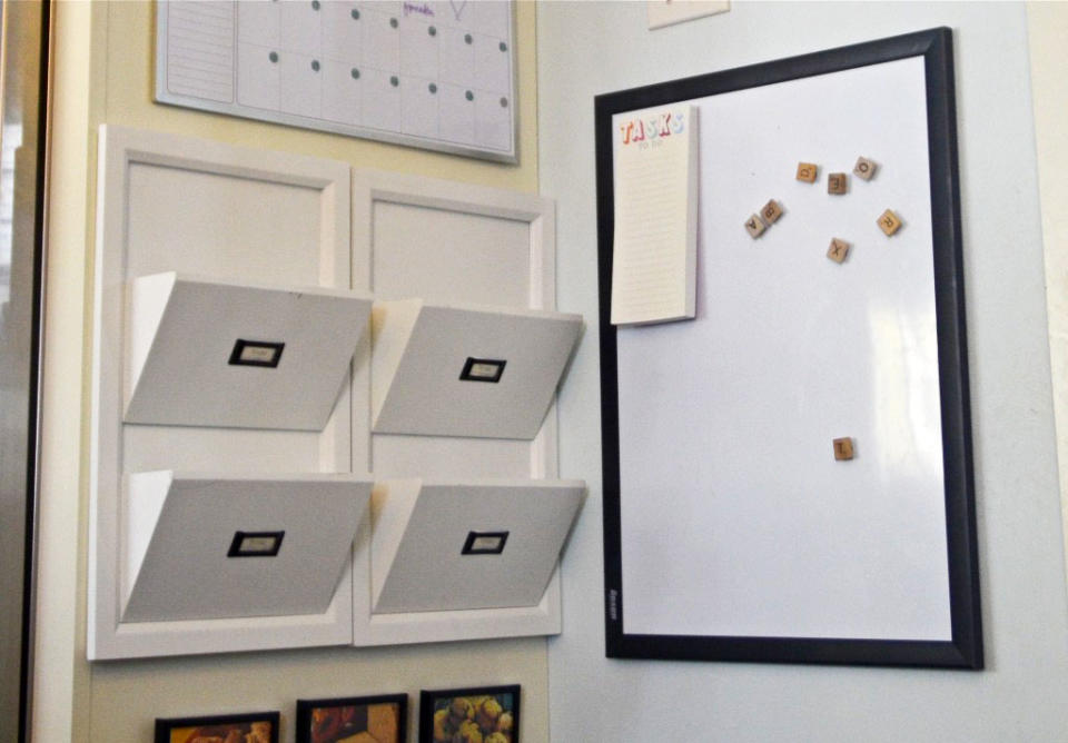 <body> <p>In many homes, the fridge serves as an informal memo board for important notes, calendars, and kids' achievements. Now formalize your <a rel="nofollow noopener" href=" http://www.bobvila.com/articles/refrigerator-troubleshooting/?#.V7xsM5MrIcg?bv=yahoo" target="_blank" data-ylk="slk:fridge;elm:context_link;itc:0;sec:content-canvas" class="link ">fridge</a>'s second function by turning one of its sides into a command center. Add a white board and some well-placed cubbies to create a landing place for family schedules and weeknight recipes.</p> <p><strong>Related: <a rel="nofollow noopener" href=" http://www.bobvila.com/slideshow/get-custom-kitchen-cabinets-with-7-easy-installs-48307?bv=yahoo" target="_blank" data-ylk="slk:Get Custom Kitchen Cabinets With 7 Easy Installs;elm:context_link;itc:0;sec:content-canvas" class="link ">Get Custom Kitchen Cabinets With 7 Easy Installs</a> </strong> </p> </body>