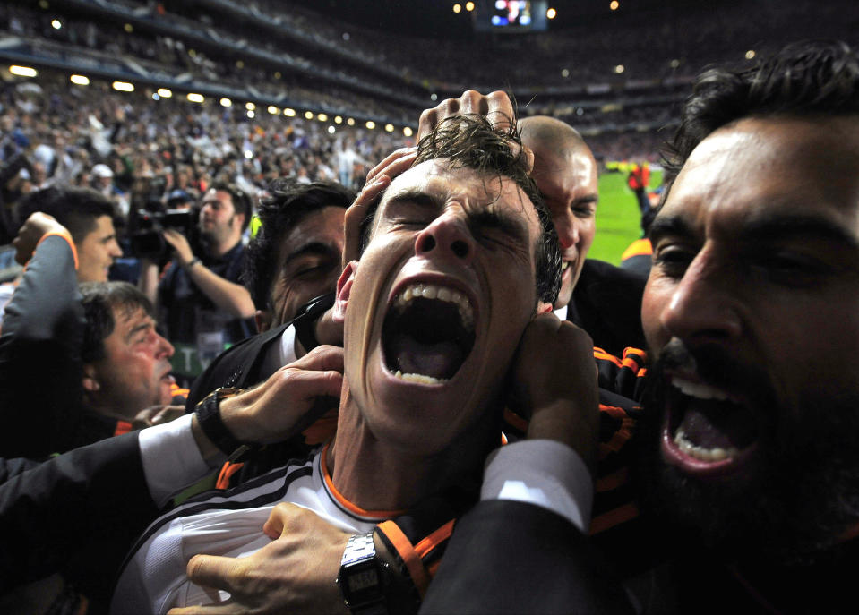 FILE - Real Madrid's Gareth Bale celebrates with teammates after scoring his side's second goal in the Champions League final soccer match against Atletico Madrid at the Luz Stadium in Lisbon, Portugal, Saturday, May 24, 2014. (AP Photo/Manu Fernandez, File)