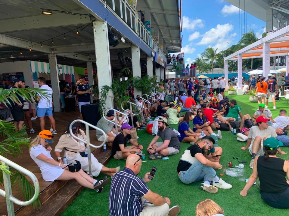 Miami Grand Prix fans eating and drinking between races, probably without having to visit an Amscot on the way to the track.