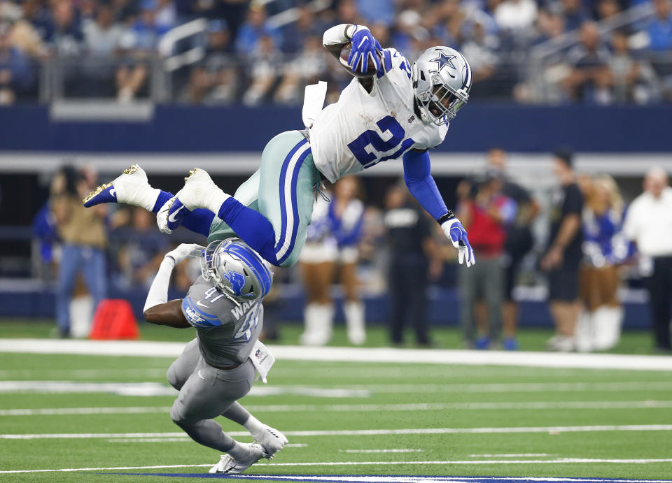 <p>Dallas Cowboys running back Ezekiel Elliott (21) leaps over Detroit Lions defensive back Tracy Walker (47) during the second half on Sunday, Sept. 30, 2018 at AT&T Stadium in Arlington, Texas. The Cowboys won 26-24. (Jim Cowsert/Fort Worth Star-Telegram/TNS via Getty Images) </p>