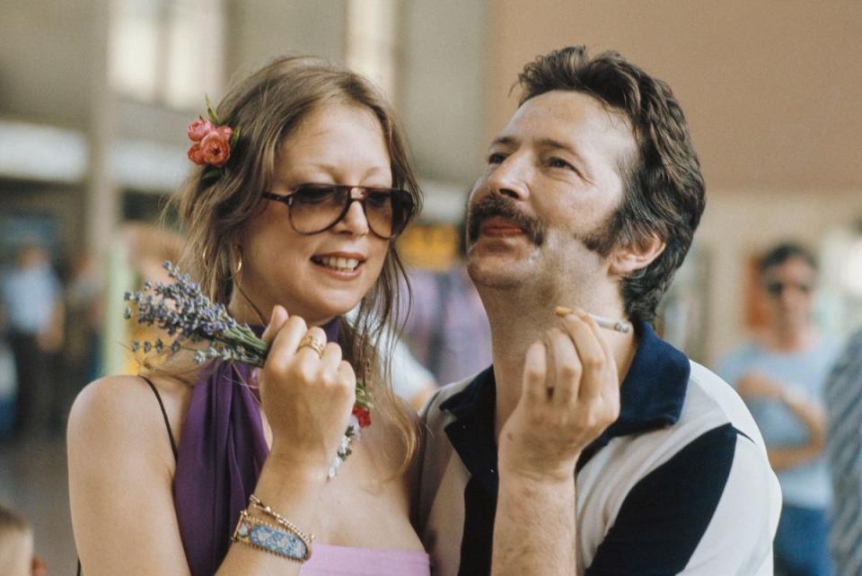 Eric Clapton with Pattie Boyd at a railway station in Germany, circa 1977 (Popperfoto via Getty Images)