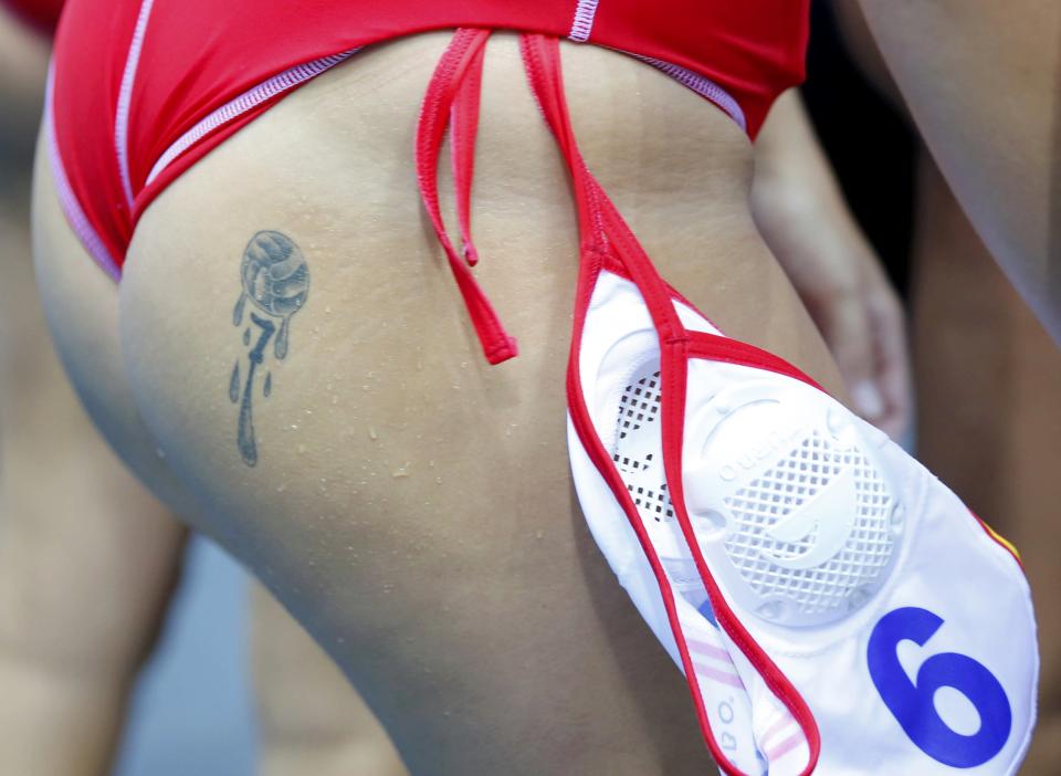 Tattoo is seen on Spain's Andrea Blas Martinez during their women's water polo quarterfinal round against Great Britain at the Water Polo Arena during the London 2012 Olympic Games August 5, 2012. REUTERS/Laszlo Balogh (BRITAIN - Tags: SPORT OLYMPICS SPORT WATER POLO) 