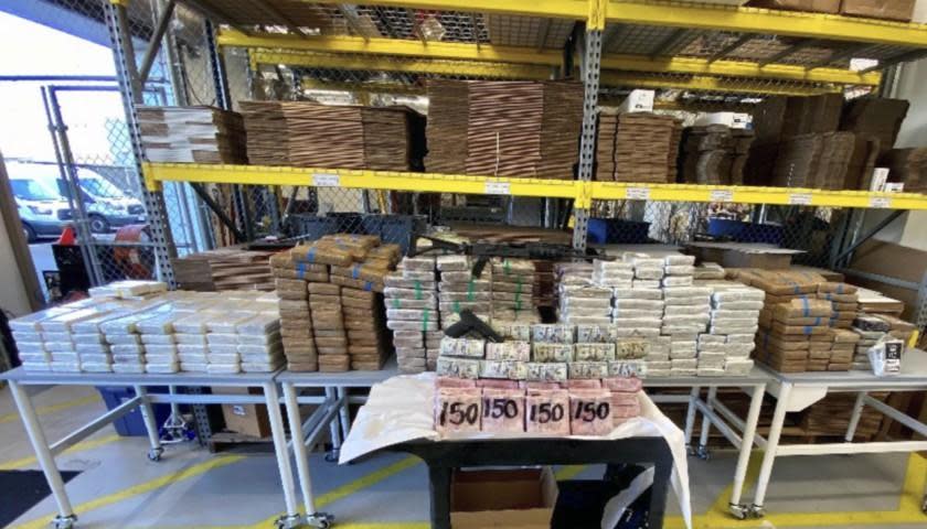 Federal agents seized $3.5 million in cash, about three-quarters of a ton of cocaine, 53 pounds of fentanyl and about 20,000 rounds of .50-caliber ammunition from an Otay Mesa truck yard, according to the U.S. Attorney for the Southern District of California. / Credit: Handout/U.S. Department of Justice