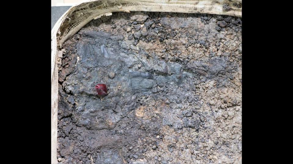 Experts “micro-excavated” a square of soil to discover the cross, officials said.