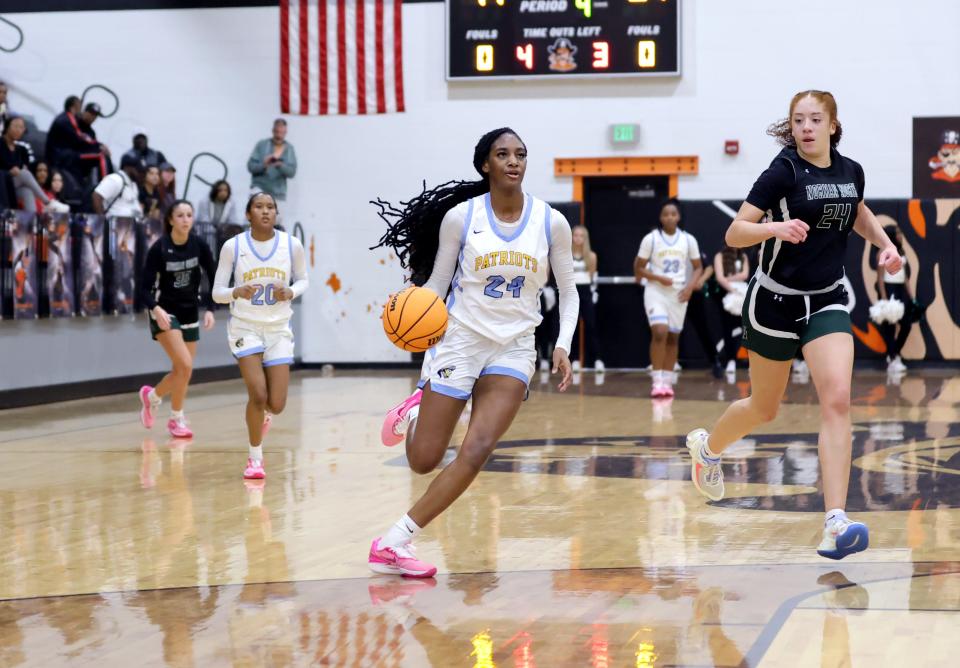 Putnam City West's Caya Smith drives up court during the Putnam City Invitational girls championship basketball game between Putnam City and Norman North at Putnam City High School in Oklahoma City, Saturday, Jan. 6, 2024.