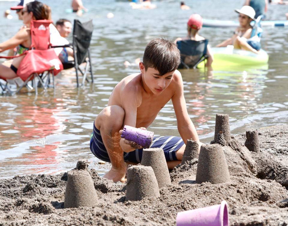Isaiah Hildebrand of Redding builds a sand castle on the beach at Lake Siskiyou Camp Resort outside Mount Shasta on Thursday, July 28, 2022. That day was a hot one in Mount Shasta as the temperature reached 105 degrees.