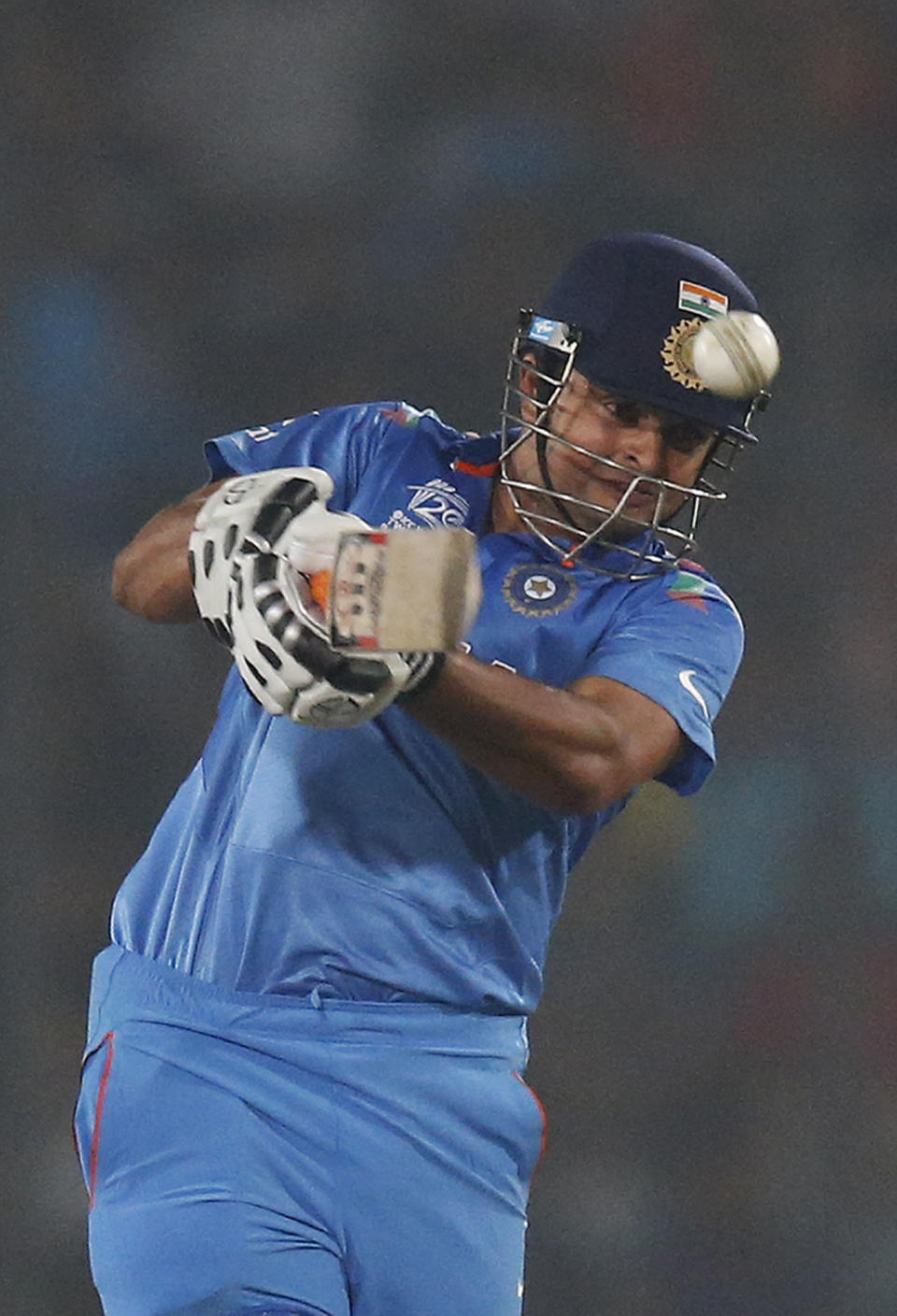 India's batsman Suresh Raina plays a shot during their ICC Twenty20 Cricket World Cup match against Pakistan in Dhaka, Bangladesh, Friday, March 21, 2014. (AP Photo/Aijaz Rahi)