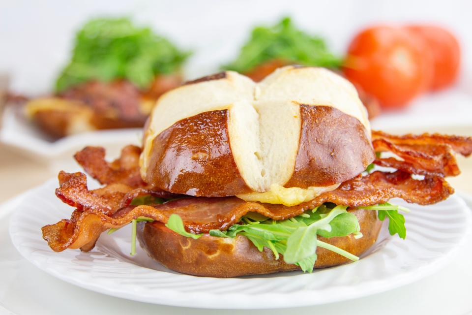 Veteran astronaut Bruce Melnick is a fan of the cranberry, arugula, gouda and apple wood bacon sandwich on a pretzel bun that is available at the Kennedy Space Center Visitor Complex's Orbit Cafe during Taste of Space: Fall Bites.