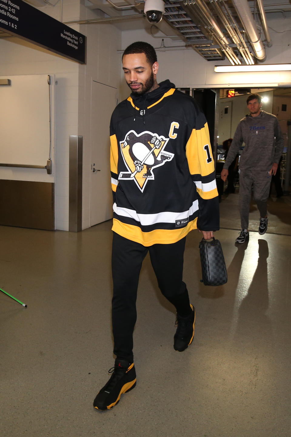 <p>Cameron Reynolds wears a Philadelphia Penguins jersey and a pair of Jordan 13s before the Timberwolves game against the 76ers on March 30. </p>