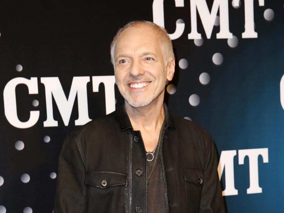 FILE - This Dec. 3, 2013 file photo shows Peter Frampton posing on the red carpet at the CMT "Artists of the Year at Bridgestone Arena in Nashville, Tenn. The Musicians Hall of Fame inducted 12 new members, Tuesday, Jan. 28, 2014, across the genres, including bluesman Buddy Guy, British rock guitarist Peter Frampton and pedal steel player and country singer Barbara Mandrell. (Photo by Donn Jones/Invision/AP, File)