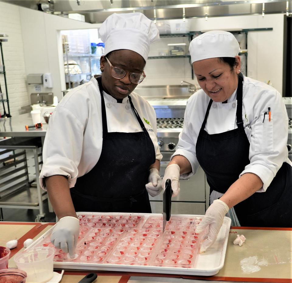 Abieyuwa Alakpa, of Sussex Borough, left, and Ruxt Rodriguez of Newton, prepare handmade bonbons at the Sussex County Community College's culinary center on Main Street, next to the Newton Post Office.