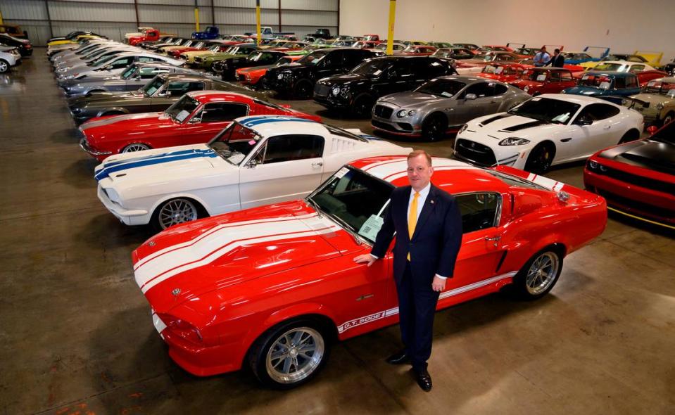 McGregor Scott, U.S. attorney, stands next to a 1967 Ford Shelby GT 500 at a warehouse in Woodland on Sept. 16, 2019. The car was one of 150 auctioned after they were seized by the government in connection with a massive Ponzi scheme out of Benicia.