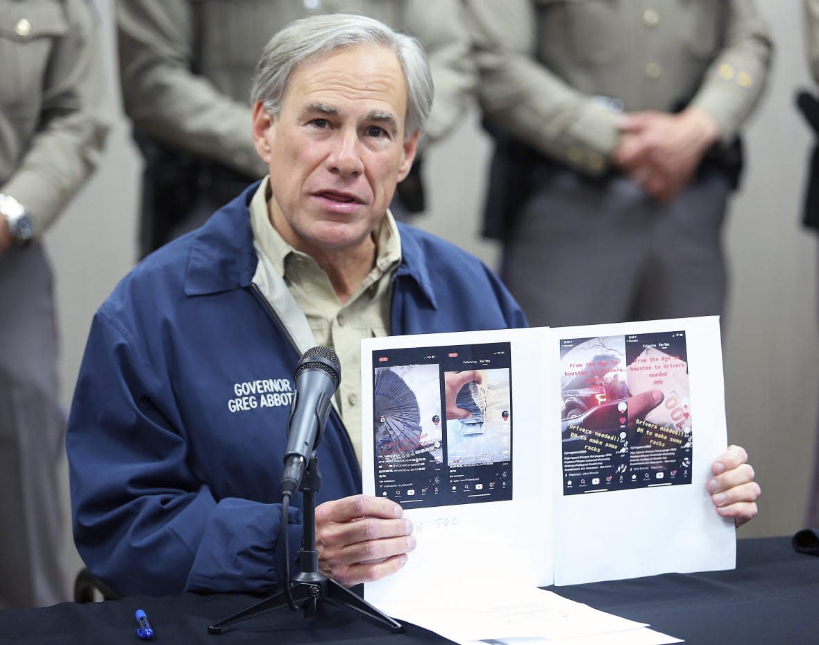 Texas Gov. Greg Abbott displays screen shots of TikTok videos used by organized crime to recruit members gathered by law enforcement as he talks about Operation Lone Star during a news conference, April 1, 2021, in Weslaco, Texas. (Joel Martinez/The Monitor via AP, file)