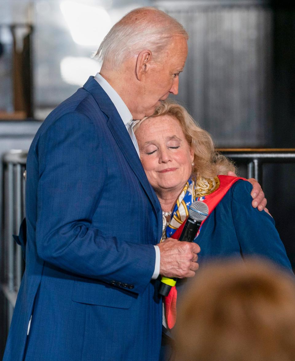 President Joe Biden hugs congresswoman Debbie Dingell at the Garage Grill and Fuel Bar in Northville before he delivers a speech to a large crowd at Renaissance High School in Detroit on Friday, July 12, 2024.