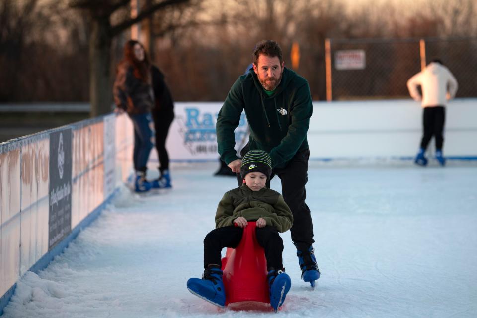 Nick Farrell of Feasterville helps his son Nick skate at Flight on Ice Neshaminy Mall on Thursday, Dec. 29, 2022.