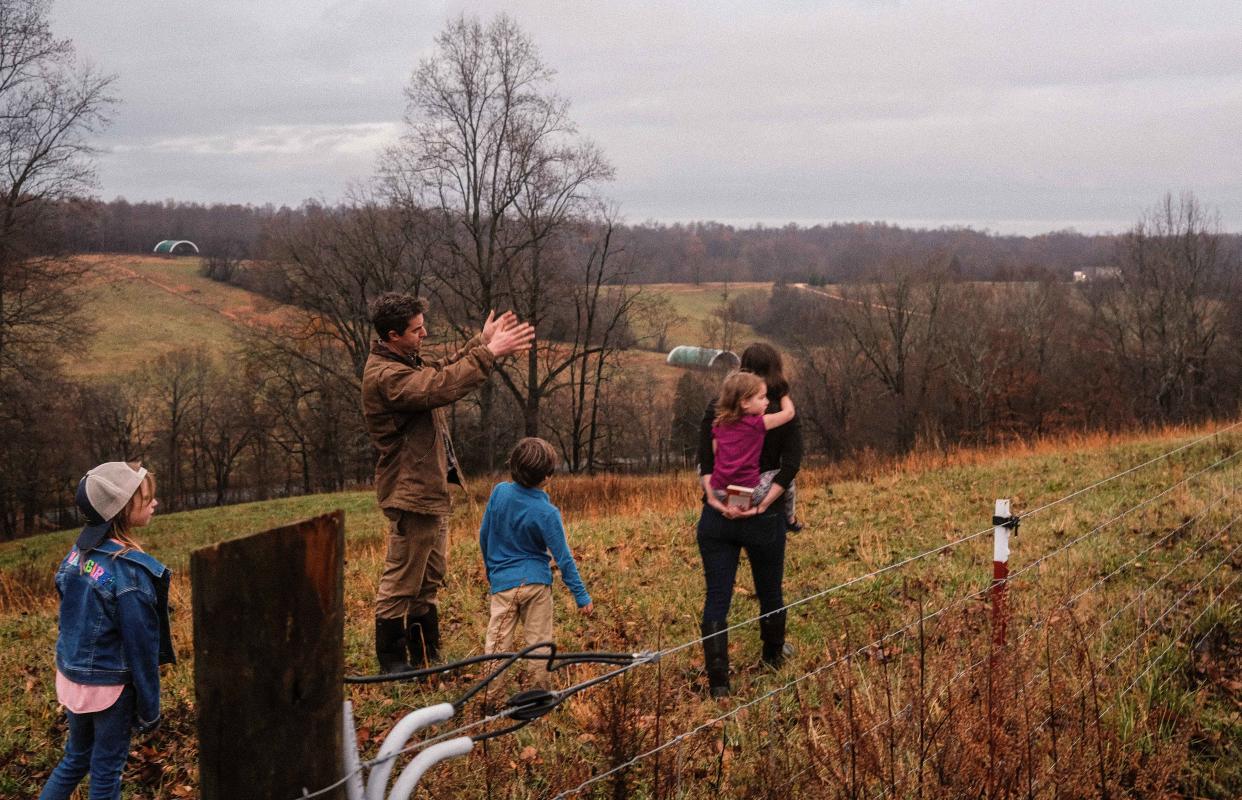 Sam Kennedy III points out how he fences in his property to help maintain organization of his property as well as keeping the grounds maintained and healthy at Kettle Mills Farm in Columbia, Tenn. on Nov. 29, 2022. 