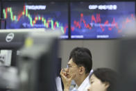 A currency trader watches monitors at the foreign exchange dealing room of the KEB Hana Bank headquarters in Seoul, South Korea, Monday, June 10, 2019. Asian financial markets advanced on Monday after China released better-than-expected trade data for May. Gains were reined in by worries over where the world’s two largest economies stood on trade negotiations. (AP Photo/Ahn Young-joon)