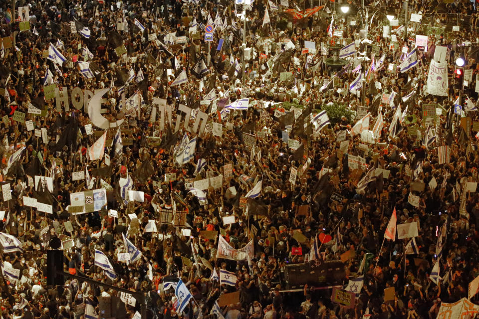 Thousands protest against Israel's Prime Minister Benjamin Netanyahu in front of his official residence in Jerusalem, Saturday, Aug. 8, 2020. (AP Photo/Ariel Schalit)