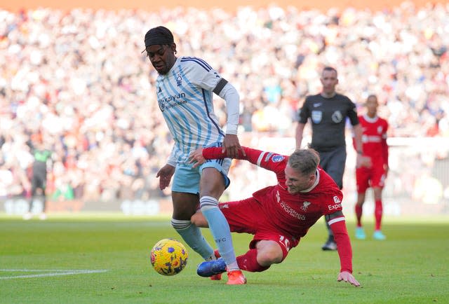 Liverpool's Alexis Mac Allister tackles Nottingham Forest’s Anthony Elanga