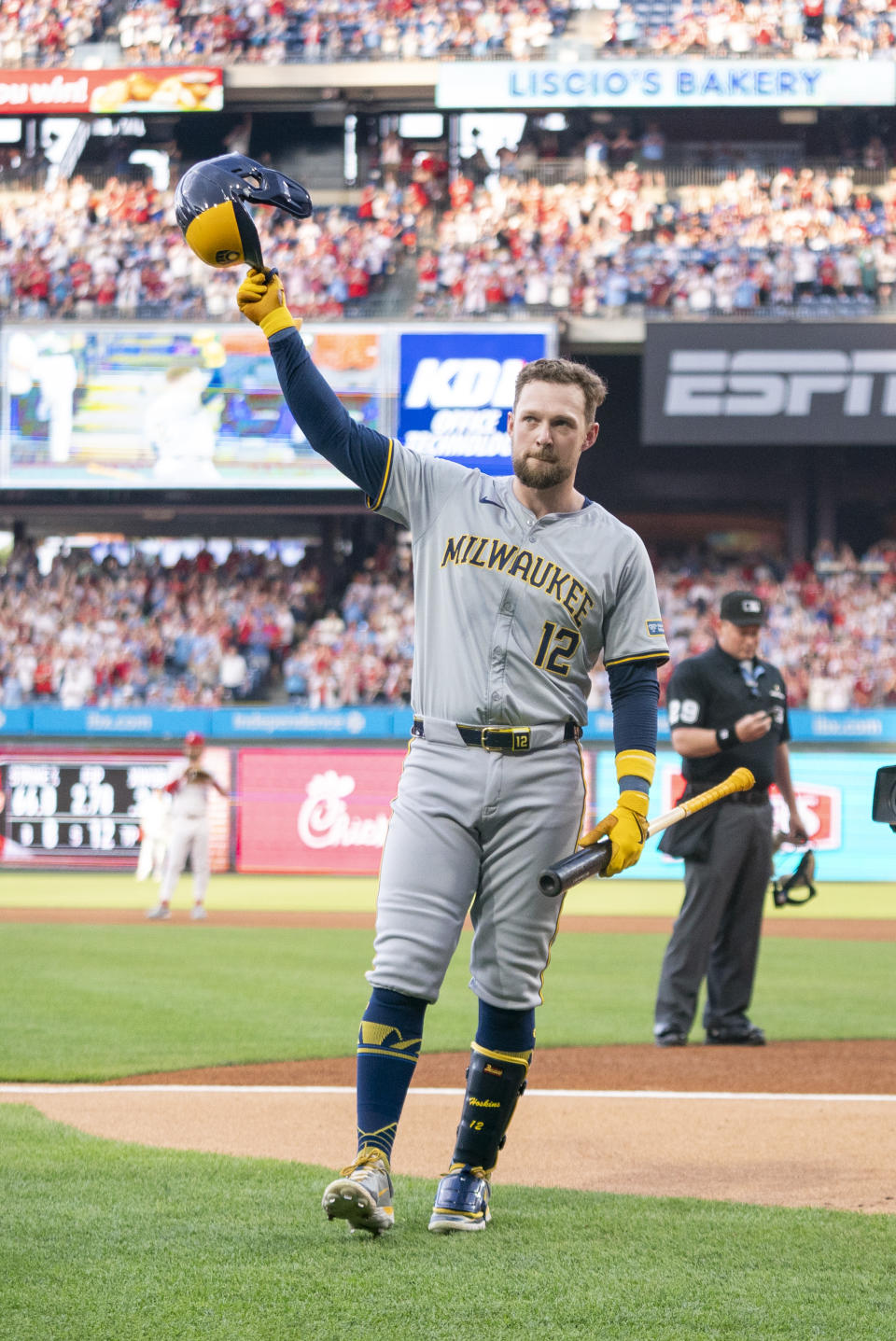 Milwaukee Brewers' Rhys Hoskins reacts to an ovation from the crowd before his first at-bat during the second inning of a baseball game against the Philadelphia Phillies, Monday, June 3, 2024, in Philadelphia. (AP Photo/Chris Szagola)