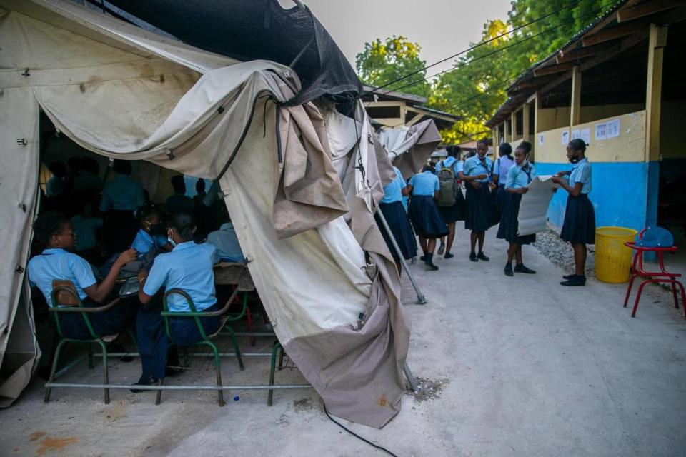 Students attend their first day back to Lycee Marie Jeanne school amid the COVID-19 pandemic in Port-au-Prince, Haiti, Monday, Aug. 17, 2020.