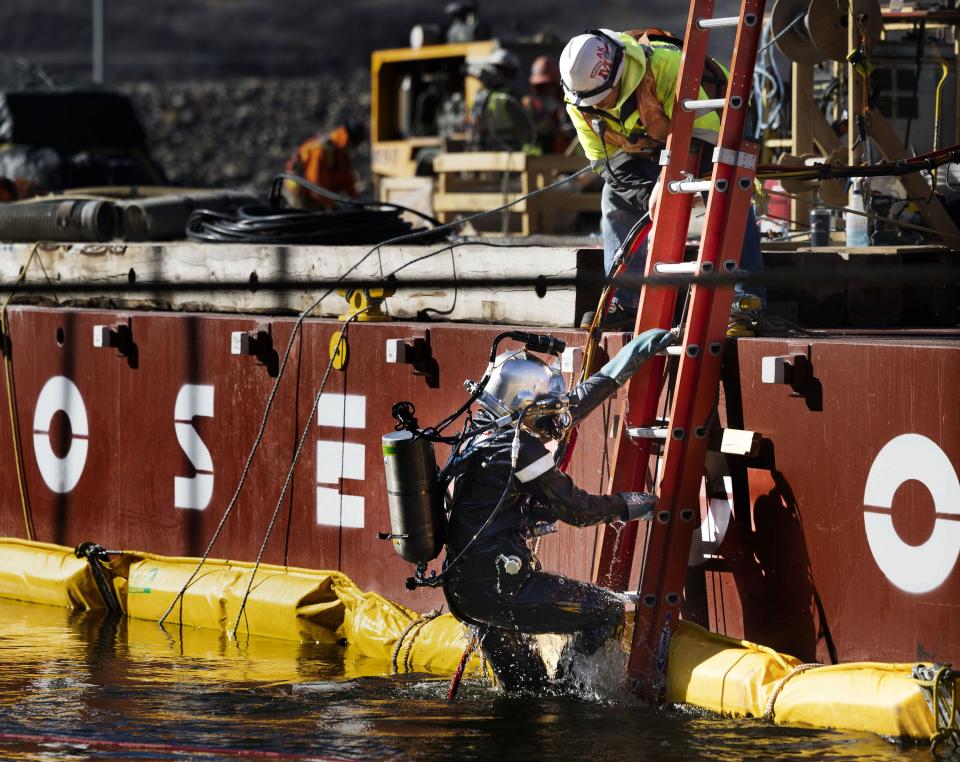 Underwater construction diver Jacob Schultz exits the water after grouting panels of the intake structure at the Deer Creek Intake Project in Heber City on Wednesday, Nov. 15, 2023. | Laura Seitz, Deseret News