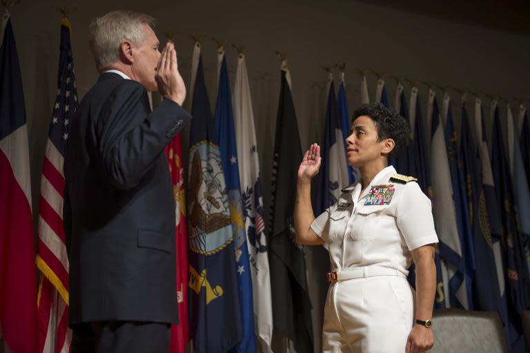 US Secretary of the Navy Ray Mabus promotes Michelle Howard to the rank of admiral, the first woman to hold the rank in the history of the US Navy, on July 1, 2014 in Washington, DC