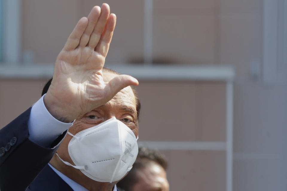 FILE - Silvio Berlusconi waves as he leaves the San Raffaele hospital in Milan, Italy, on Sept. 14, 2020. Former Italian Premier Silvio Berlusconi was hospitalized Wednesday, April 5, 2023, with apparent respiratory problems, Italian media reported. The 86-year-old three-time premier was in intensive care at Milan’s San Raffaele hospital, the clinic where he routinely receives care, LaPresse news agency, Sky TG24 and Corriere della Sera reported, without citing sources. (AP Photo/Luca Bruno, File)
