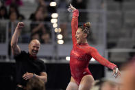 Utah's Makenna Smith celebrates after her uneven-bars routine during the NCAA women's gymnastics championships in Fort Worth, Texas, Thursday, April 18, 2024. (AP Photo/Tony Gutierrez)