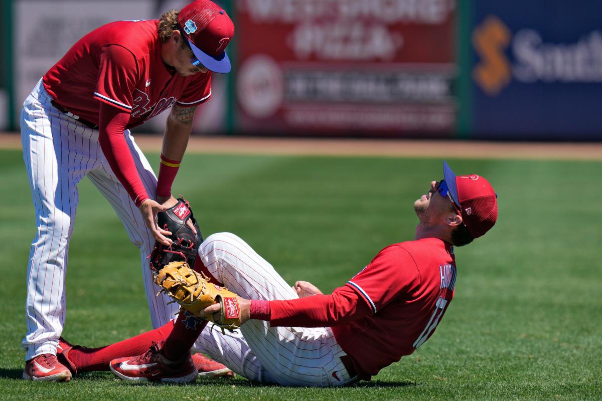 Rhys Hoskins of the Philadelphia Phillies blows a bubble during a