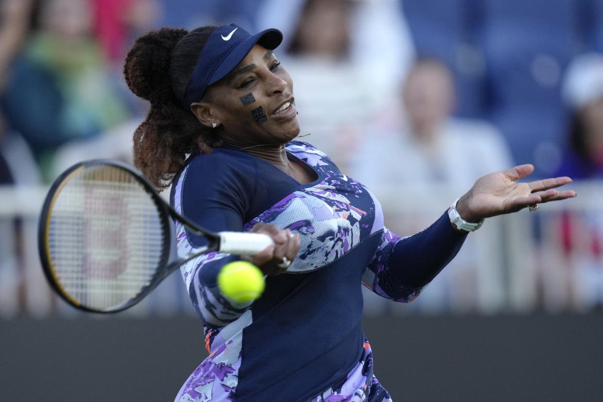 Serena Williams of the United States returns the ball during her quarterfinal doubles tennis match with Ons Jabeur of Tunisia against Shuko Aoyama of Japan and Hao-Ching of Taiwan at the Eastbourne International tennis tournament in Eastbourne, England, Wednesday, June 22, 2022. (AP Photo/Kirsty Wigglesworth)