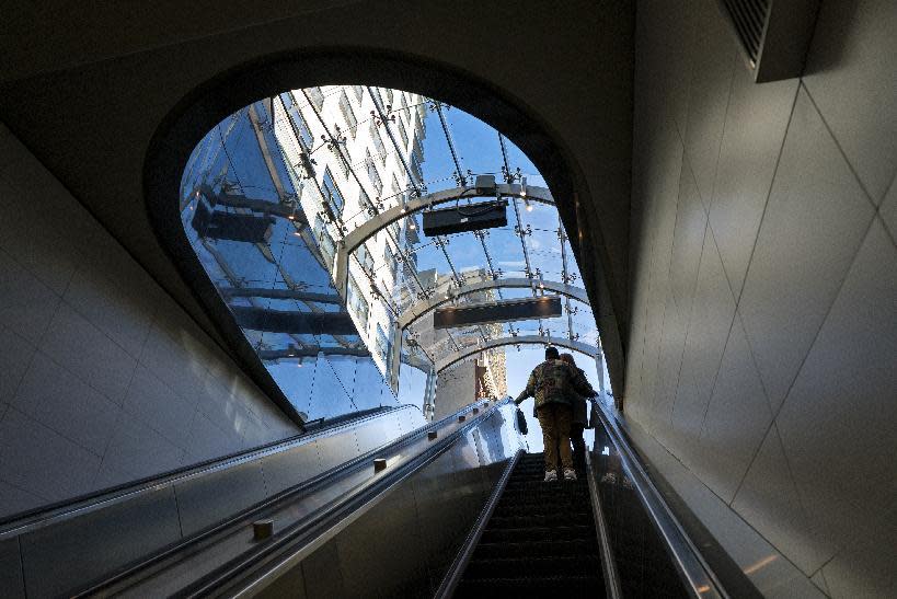 People exit the newly opened Second Ave. Subway in New York Sunday, Jan. 1, 2017. The opening of three stations on the newly opened Second Ave. subway marks a decades long plan to bring rail transportation to Manhattan's Upper East Side. (AP Photo/Craig Ruttle)