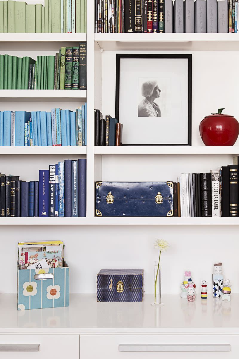 <p>While there are a variety of visually appealing ways to organize bookshelves, a color-coordinated look never fails to make you want to read to your heart's content. </p>