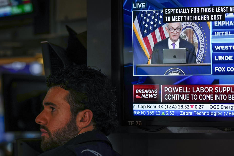 A press conference by Federal Reserve chairman Jerome Powell is displayed on the floor at the New York Stock Exchange in New York, Wednesday, Sept. 20, 2023. The Federal Reserve left its key interest rate unchanged for the second time in its past three meetings, a sign that it's moderating its fight against inflation as price pressures have eased. (AP Photo/Seth Wenig)