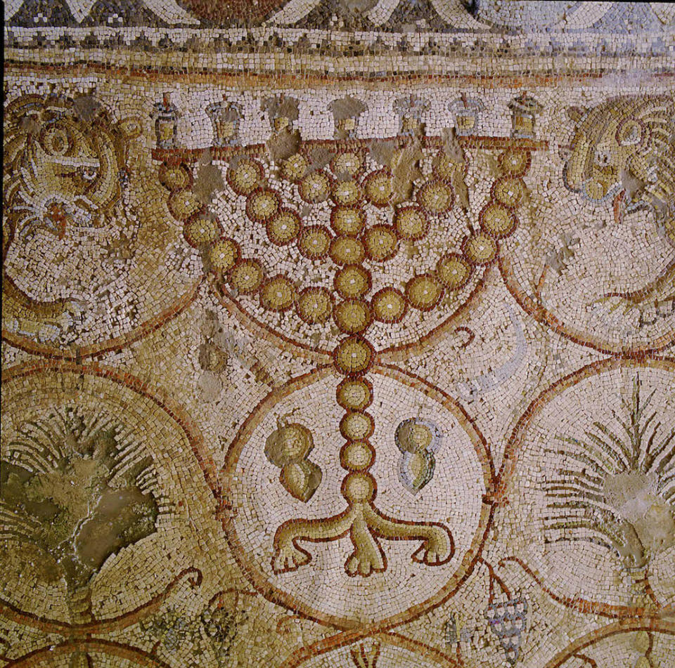 Two citron fruits were included in this sixth-century mosaic of a menorah from the Maon Synagogue, located in modern-day Israel's Negev Desert. <cite>Photograph by Clara Amit/Courtesy of the Israel Antiquities Authority</cite>