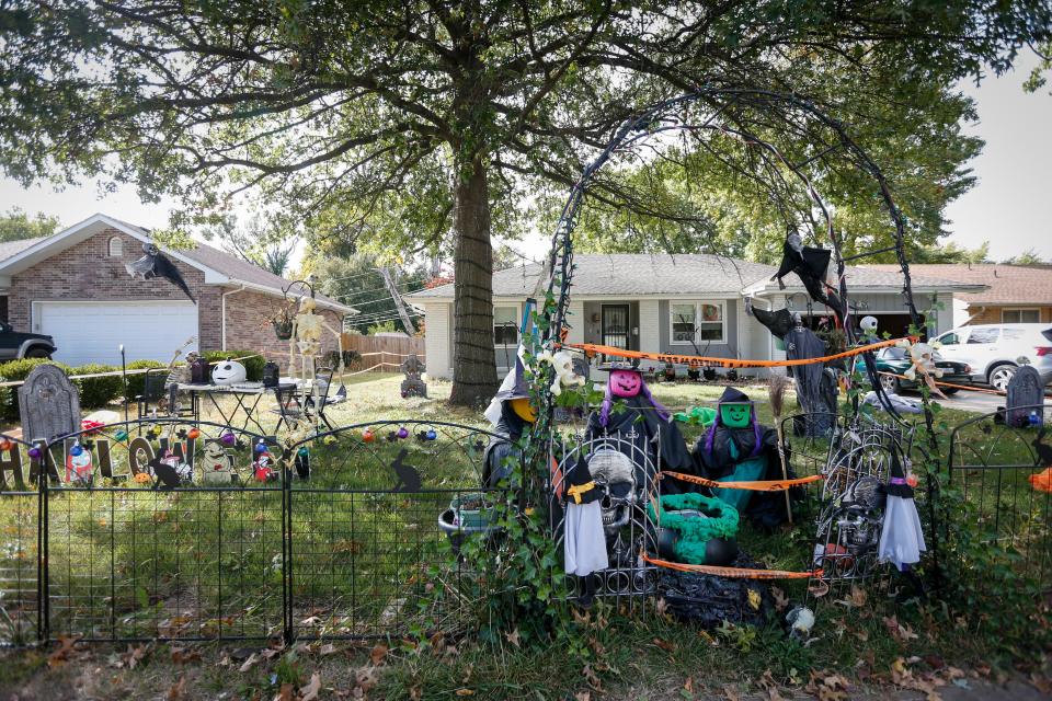 A variety of Halloween decorations stand in the yard of 2633 S. National Ave on Friday, Oct. 14, 2022.