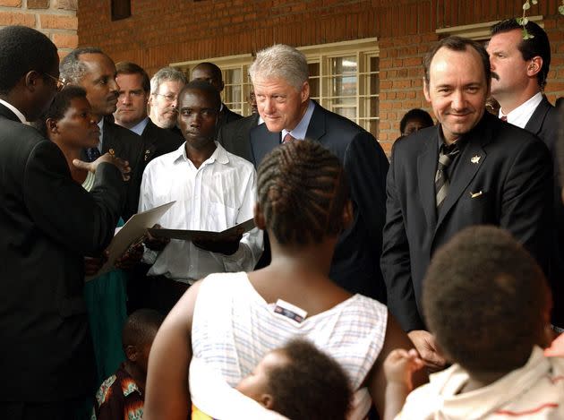 Former President Bill Clinton and actor Kevin Spacey at a stop in Kigali, Rwanda, in September 2002.