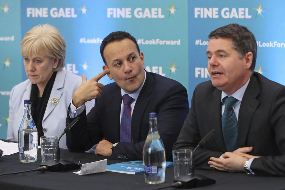 Ireland's Minister for Business, Enterprise, and Innovation Heather Humphreys, Prime Minister Leo Varadkar and Minister for Finance Paschal Donohoe, from left, at a press conference at the Institute of Technology Carlow in Carlow, Ireland, Thursday Feb. 6, 2020. Ireland goes to the polls for a general election on Feb. 8. (Niall Carson/PA via AP)