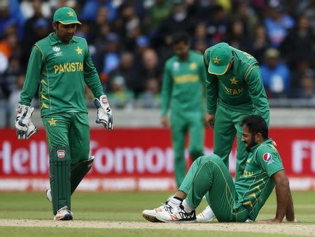 Britain Cricket - India v Pakistan - 2017 ICC Champions Trophy Group B - Edgbaston - June 4, 2017 Pakistan’s Wahab Riaz lies injured Action Images via Reuters / Paul Childs Livepic